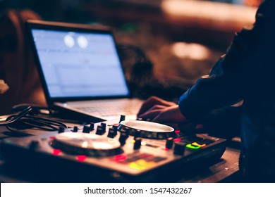 Overhead Shot Of Red Party Dj Audio Equipment.Turntable Top View. Professional Concert DJ Top View. High Quality Mixing Controller Disc Jockey In Night Club. Pro Audio Equipment On Stage In Nightclub