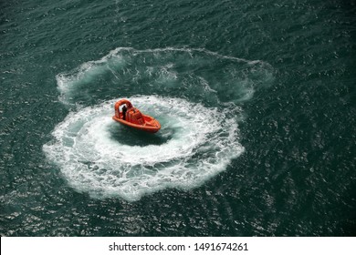 Overhead Shot Of A Rescue Boat In Ocean Moving In A Circle Pattern