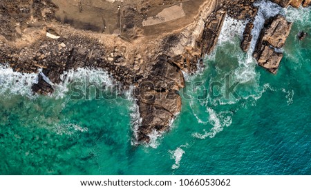 Similar – Aerial Drone View Of Dramatic Ocean Waves Crushing On Rocky Landscape