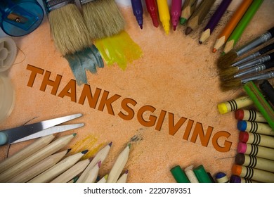 Overhead shot of school supplies with Thanksgiving text. Brushes, pencils, artistic tools. Art And Craft Work Tools. - Shutterstock ID 2220789351