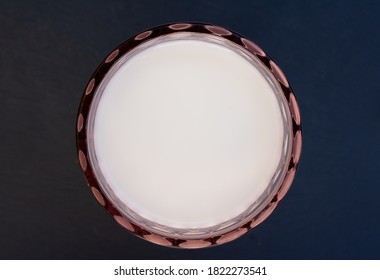 Overhead Shot Of A Stylish Glass Of Milk On A Slate Stone Background