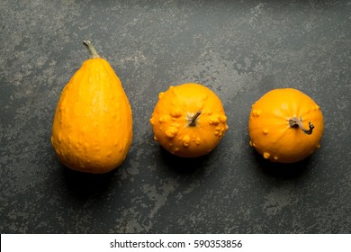 Overhead Shot Of Three Yellow Bumpy Gourd