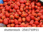 Overhead Shot tomatoes in market. ripe red tomatoes close up Beautiful red tomatoes. Top view. Header for website Tamatar pattern background. Vegetables and fruits are sold in market of india