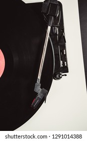 Overhead Shot Of Vintage Turntables Player Device.Old Analog Turn Table With Black Vinyl Disc Shot From Above.Tone Arm And Needle On A Record With Music