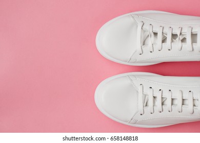 Overhead Shot Of White Sneakers On Pink Background - Shutterstock ID 658148818