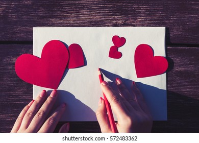 Overhead Shot Of Woman Writing Love Letter On White Paper For Saint Valentines Day Celebration.Write Love Letters For Lovers And Friends On 14 February