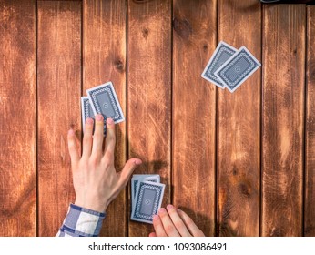 Overhead Top View Of Poker Dealer On The Wooden Table