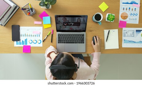 Overhead Top View Young Asian Woman Employee Work From Home Using Computer Notebook Videocall Meeting Conference Angry Annoy With Low Poor Unreliable Internet Wifi Connection Problem Issue Outage.