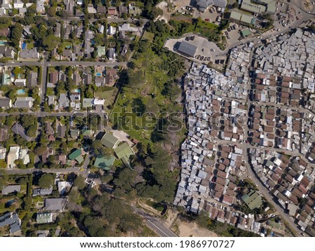 Overhead township and wealthy houses in divided South Africa