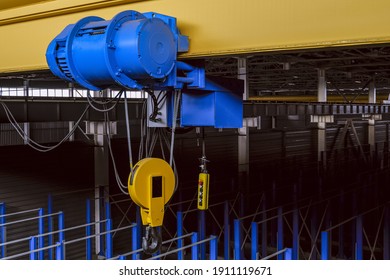 Overhead Traveling Cathead With Steel Hooks In The Factory Floor