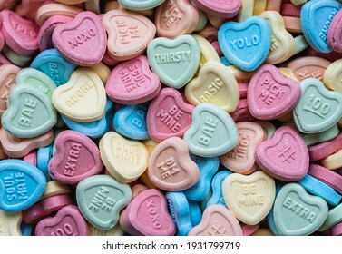 Overhead Of Valentine's Day Candy Hearts With Modern Messages On Them.