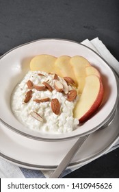 Overhead, Vertical View Of Cottage Cheese With Sliced Apple And Almonds