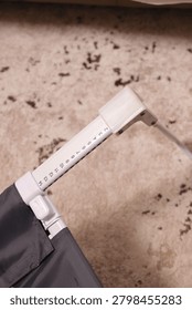 Overhead view of an adjustable bed rail leg with a folding lock mechanism.