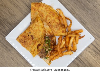 Overhead View Of Appetizing Quesadilla Birria Tortilla For A Tempting Mexican Food Delicacy.