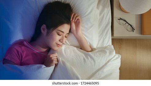 Overhead View Of Asian Woman Sleep Well With Smile At Night 