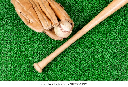 Overhead View Of Baseball Mitt, Ball And Bat On Artificial Grass 