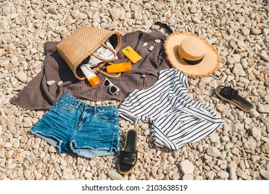 Overhead View Of Beach Stuff Blanket With Sun Protection Cream Straw Hat With Bag Flat Lay