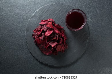 Overhead View Of Beetroot With Juice On Plate Over Slate