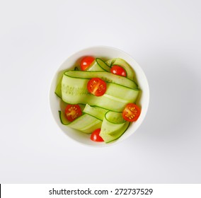 Overhead View Of Bowl With Cherry Tomatoes And Cucumbers