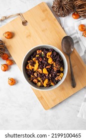 Overhead View Of A Bowl Of Forbidden (Black) Rice And Acorn Squash 