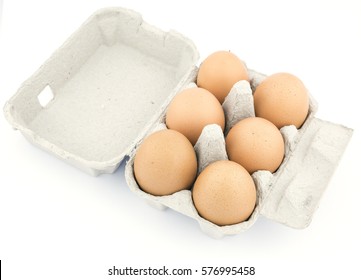 Overhead View Of Brown Chicken Eggs In An Open Egg Carton Isolated On White.