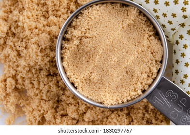 Overhead View Of Brown Sugar In Measuring Cup.  Horizontal Composition.