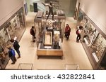 Overhead View Of Busy Museum Interior With Visitors
