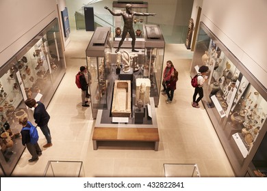 Overhead View Of Busy Museum Interior With Visitors