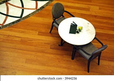 Overhead view of a cafe table with chairs