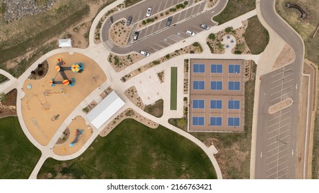 Overhead View Of Children Playground Area And Community Pickleball Sport Courts