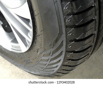 Overhead View Of Cleaned Car Tire On The Concrete Floor Close Up 