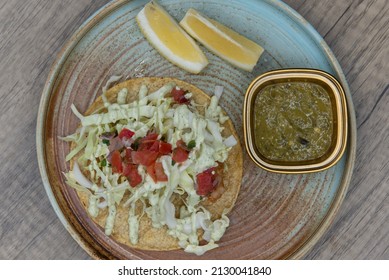 Overhead View Of Cod Beer Battered Taco Stacked Tall With Breaded Fish And Cole Slaw.