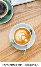 Overhead View Of Cup Of Coffee With Latte Art