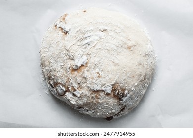 Overhead view of date jam filled sourdough bread, flatlay of date filled bread on a parchment lined baking sheet - Powered by Shutterstock