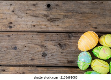 Overhead View Of Decorated Colorful Easter Eggs On Wooden Table With Empty Space. Unaltered, Copy Space, Cultures, Festival, Craft, Sweet Food, Candy, Decoration And Celebration Concept.