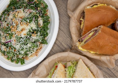 Overhead View Of Difficult Choice Of Which Salad Or Sandwich To Eat From The Buffet Table At Local Delicatessen.