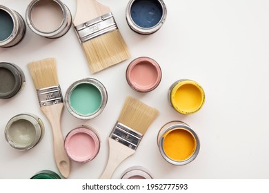 Overhead View Of A DIY Paint Brush With Colorful Sample Paint Pots