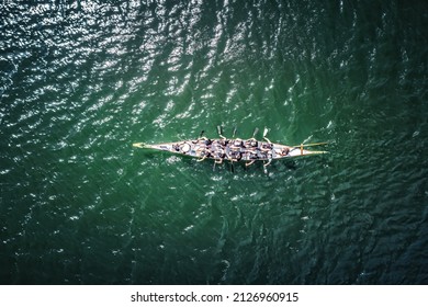 Overhead View Of Dragon Boat Racing Team.