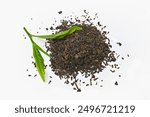 Overhead view of dried tea leaves and fresh green tea leaves isolated on white background