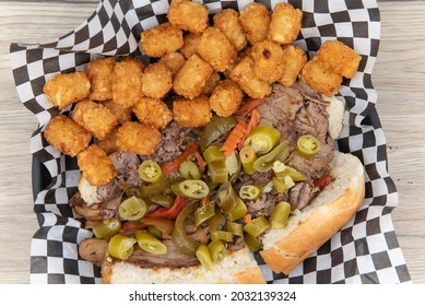 Overhead View Of Enormous Open Faced Sandwich Loaded With Meat, Tater Tots, Jalapenos And Fillings For An Appetizing Meal.