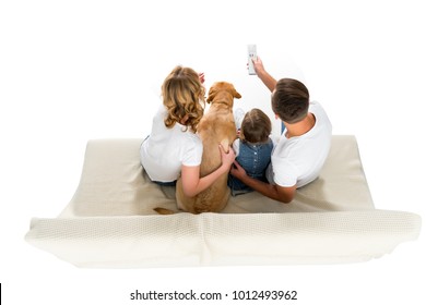 Overhead View Of Family With Dog Watching Tv On Sofa, Isolated On White