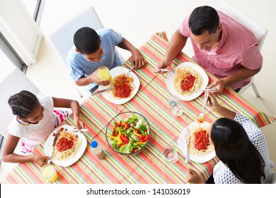 Overhead View Of Family Eating Meal Together