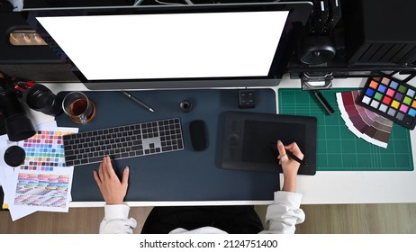 Overhead View Female Graphic Designer Working With Computer And Graphic Tablet.