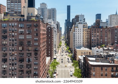 Overhead view First Avenue with traffic drivings through the buildings of Manhattan in New York City, as seen from the Roosevelt Island Tramway - Shutterstock ID 2264943109