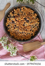 Overhead View Of A Fresh Baked Homemade Cherry Pie On Rustic Wooden Table Background In A Round Baking Pan