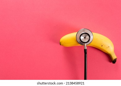 Overhead view of fresh banana with stethoscope by copy space over pink background. unaltered, organic food, healthy eating and medical equipment concept. - Powered by Shutterstock