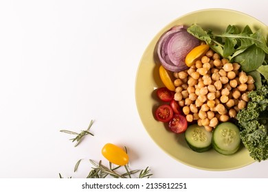 Overhead View Of Fresh Healthy Food In Bowl By Herb On White Background, Copy Space. Unaltered, Food, Studio Shot, Healthy Eating, Organic.