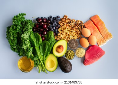 Overhead View Of Fresh Omega-3 Rich Foods: A Variety Of Healthy Foods Like Fish, Nuts, Seeds, Fruit, Vegetables, And Oil Rich In Omega-3 Nutrients