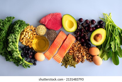 Overhead View Of Fresh Omega-3 Rich Foods: A Variety Of Healthy Foods Like Fish, Nuts, Seeds, Fruit, Vegetables, And Oil Rich In Omega-3 Nutrients