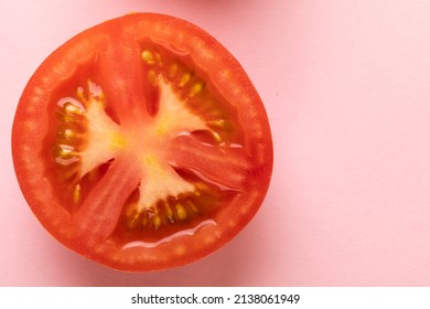 Overhead view of fresh red tomato halved cross section by copy space against pink background. unaltered, food, healthy eating, organic concept. - Shutterstock ID 2138061949